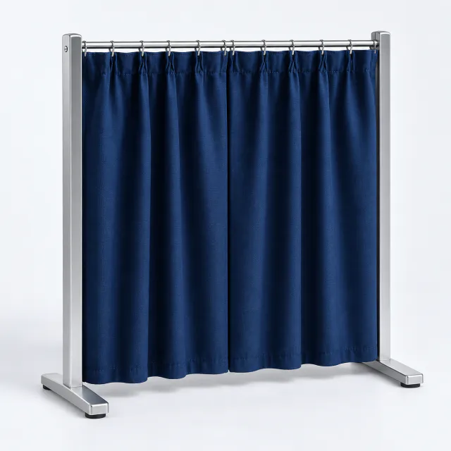 Small freestanding silver frame with closed midnight-blue pleated curtains